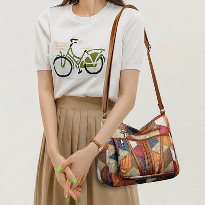 Bolso de mano de piel con mosaico
